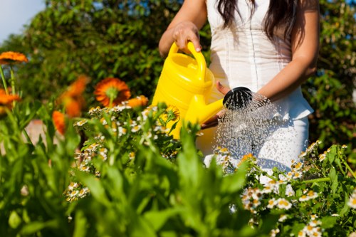 Gardeners estimating cubic-yard waste volume for a local garden